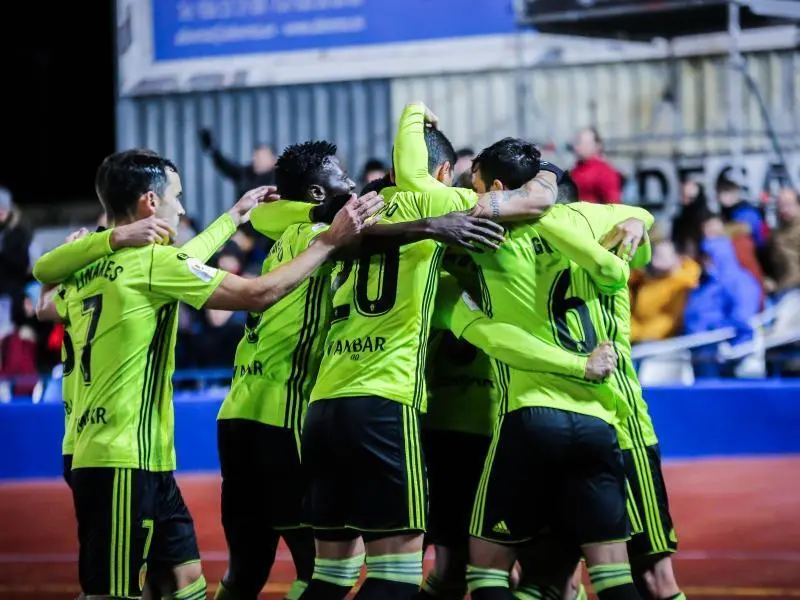Los jugadores del Real Zaragoza celebrando el gol de Papu en Socu&eacute;llamos. Foto: Real Zaragoza