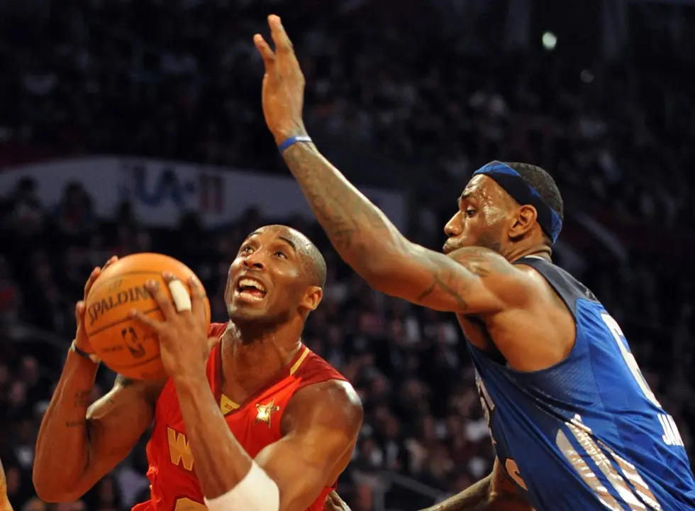 Kobe Bryant (L) of the L.A. Lakers playing for the West team, gets past East Team's LeBron James of the Miami Heat during the All-Stars Game at the Staples Center in Los Angeles on February 20, 2011. The game won by the West team 148-143 is the 60th NBA All-Star Game showdown between the Eastern and Western conference superstars.        AFP PHOTO/Mark RALSTON (Photo credit should read MARK RALSTON/AFP via Getty Images)